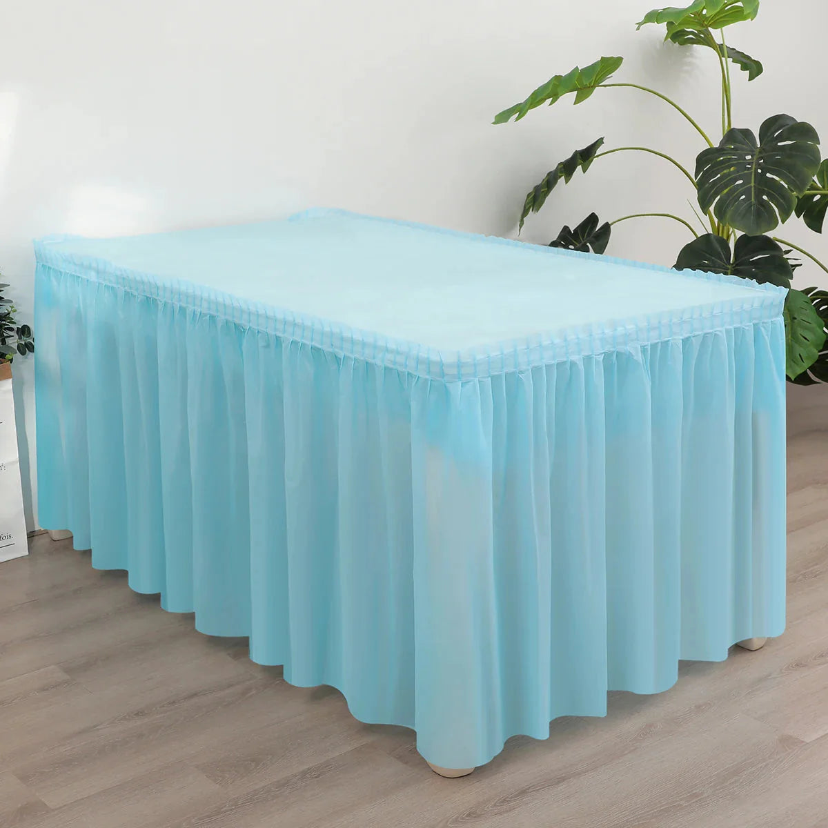 SHOWLU FASHION 2-piece disposable tablecloth and table skirt set, featuring a sleek design for event decorations and table coverings.