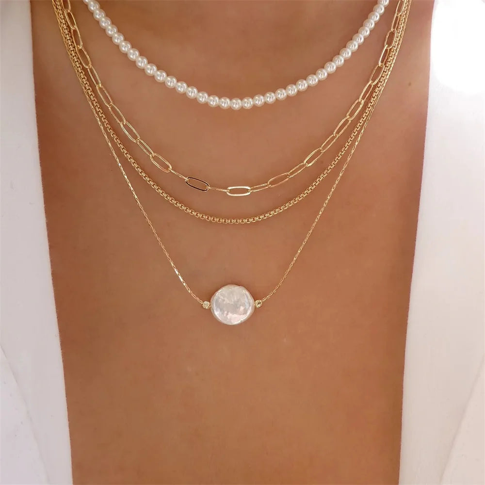 Vintage elegant round pearl pendant necklace for women, featuring multi-layer gold choker chain and trendy jewelry design.