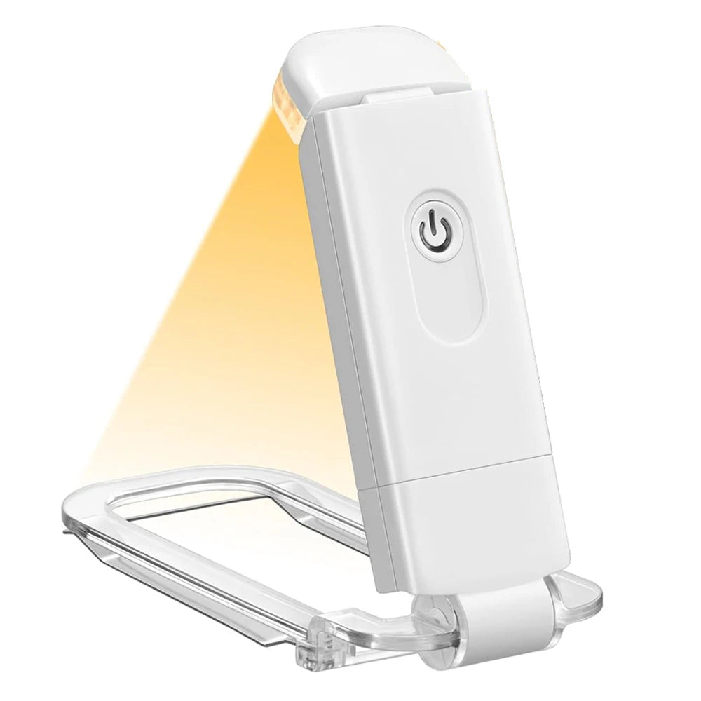 USB rechargeable Amber Book Light by Showlu Smart General, showing a compact, warm amber LED book light with charging port.