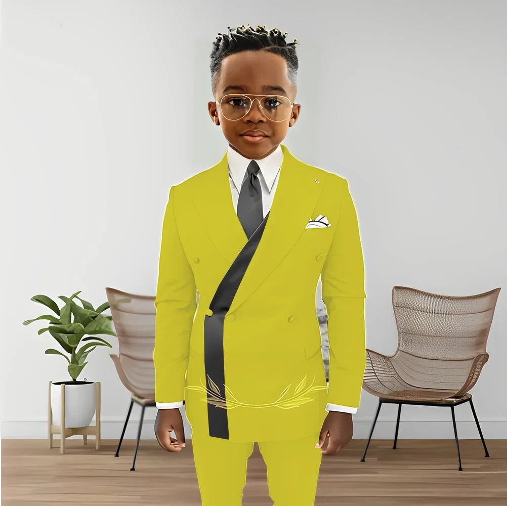 Boy wearing a stylish double-breasted blazer and matching pants from Showlu Fashion's kids tuxedo set, suitable for special occasions.