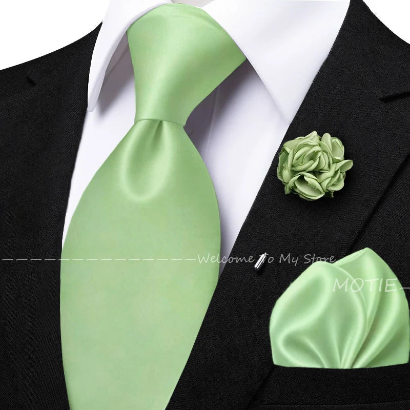 Men's sage green tie set with pocket square, flower brooch, cufflinks, and collar accessories for wedding or daily wear.