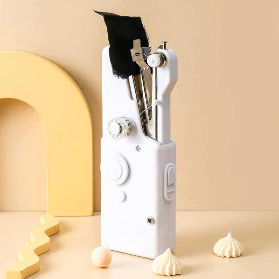 Showlu Smart General mini handheld sewing machine with compact design and thread spool, ideal for small sewing projects.