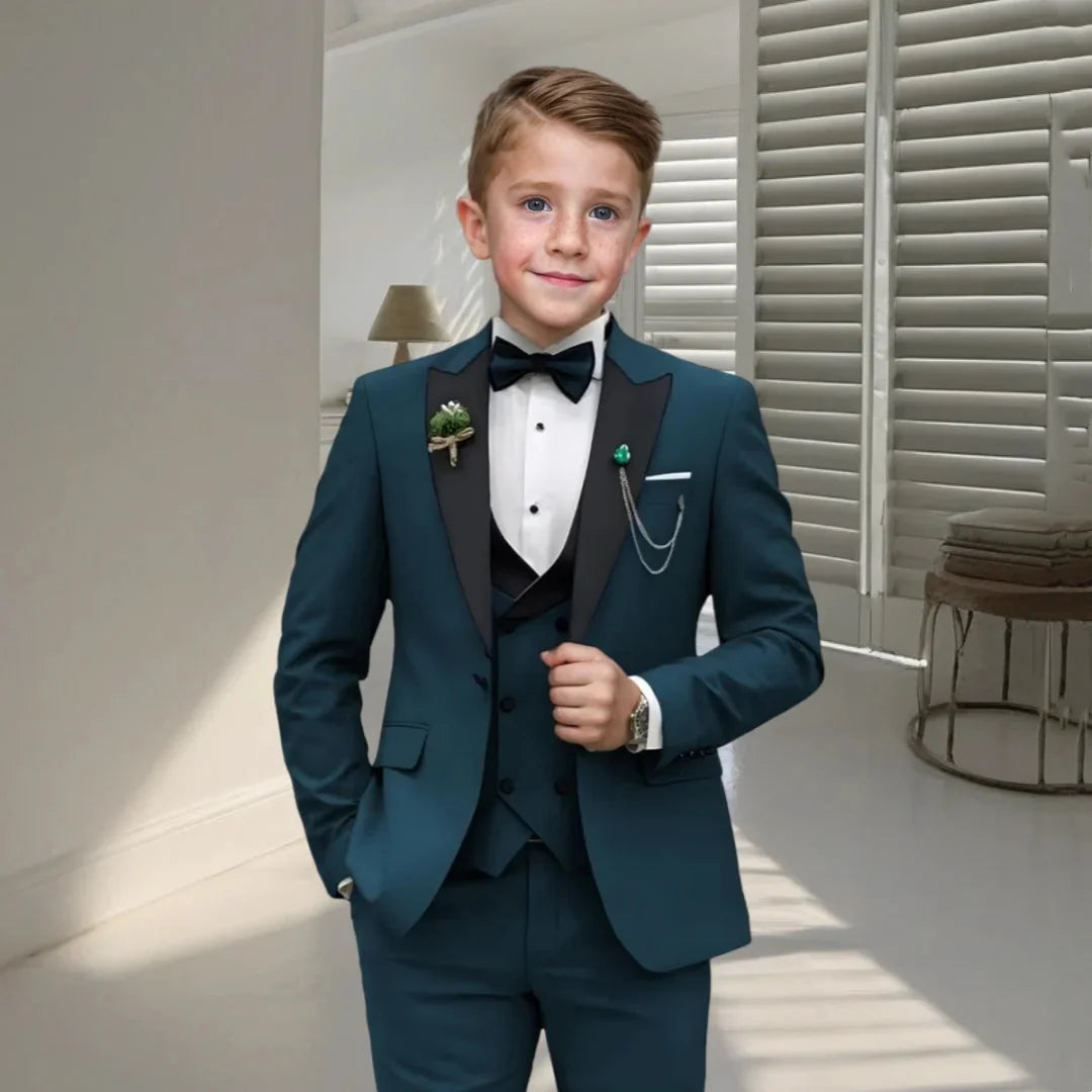 Boys' velvet tuxedo suit set with champagne blazer, dress pants, vest, and bow tie, perfect for formal occasions.