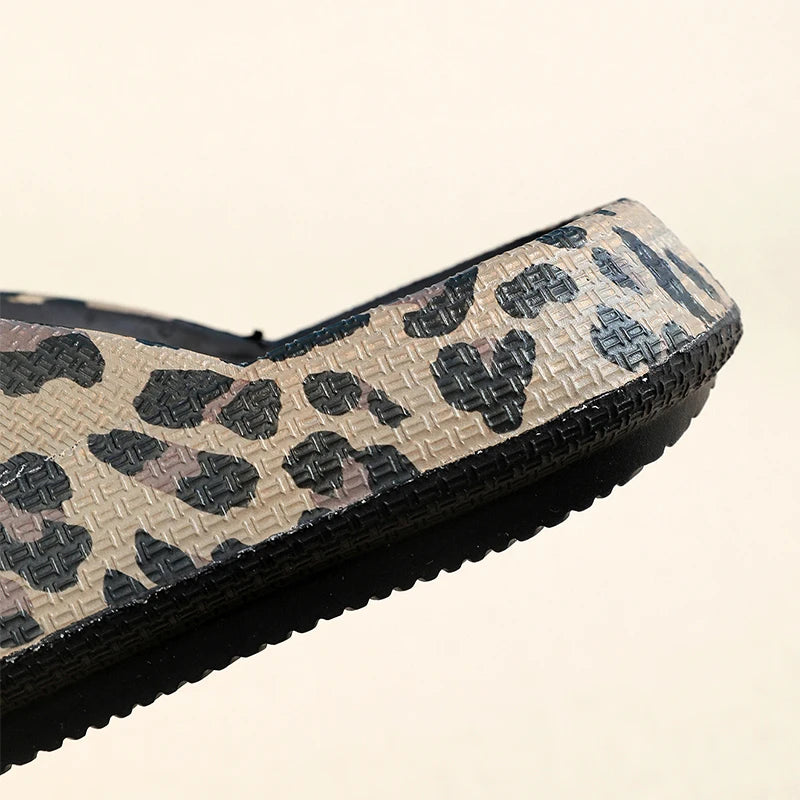 Leopard print women's comfort flip-flops with thick soles, soft cloud slippers for summer travel and beach vacations.