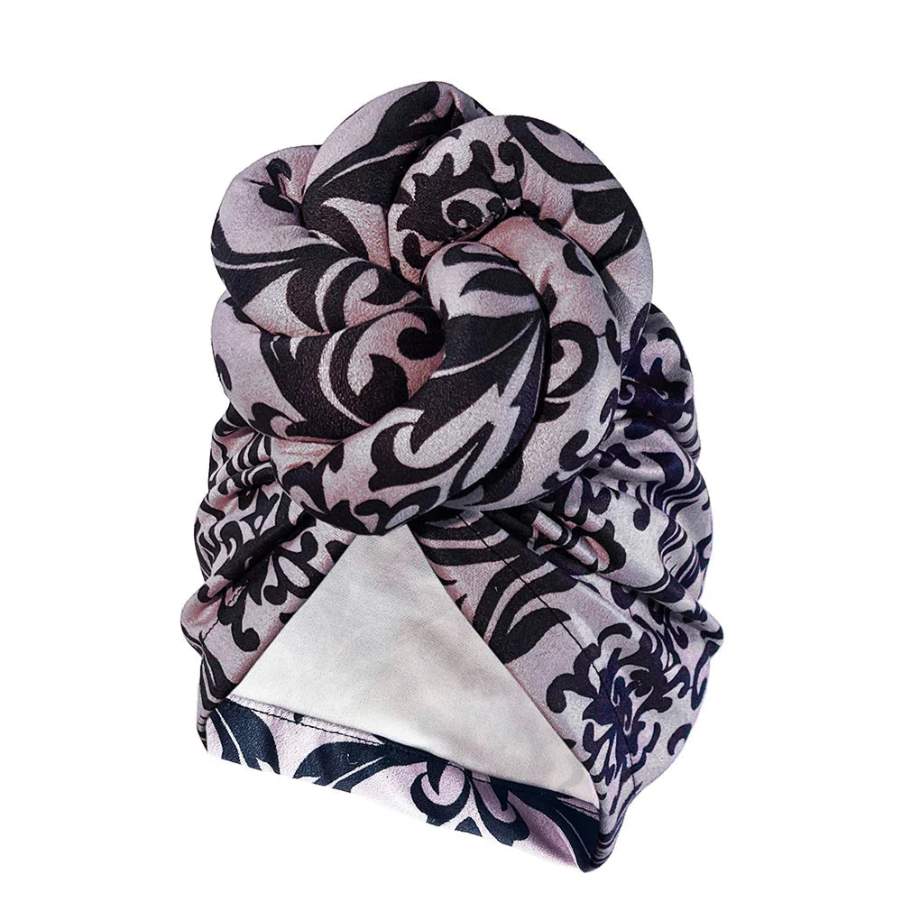 SHOWLU Knotted Head Wrap with luxury floral polyester design, stylish party headdress worn as a fashionable head accessory.