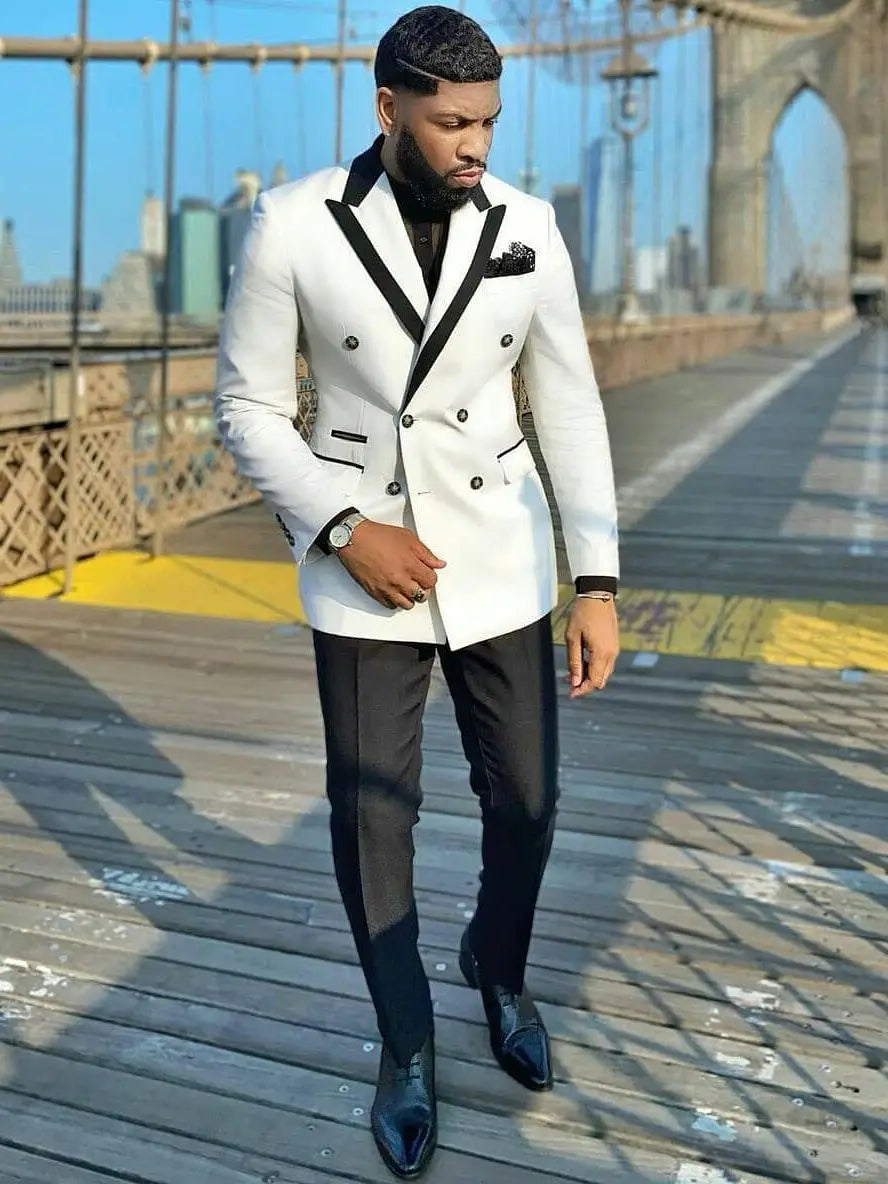 Men's tailored white double-breasted suit with peak lapel, slim fit tuxedo jacket and trousers, perfect for formal occasions.