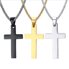 Three stainless steel cross pendant necklaces in black, gold, and silver on matching link chains.