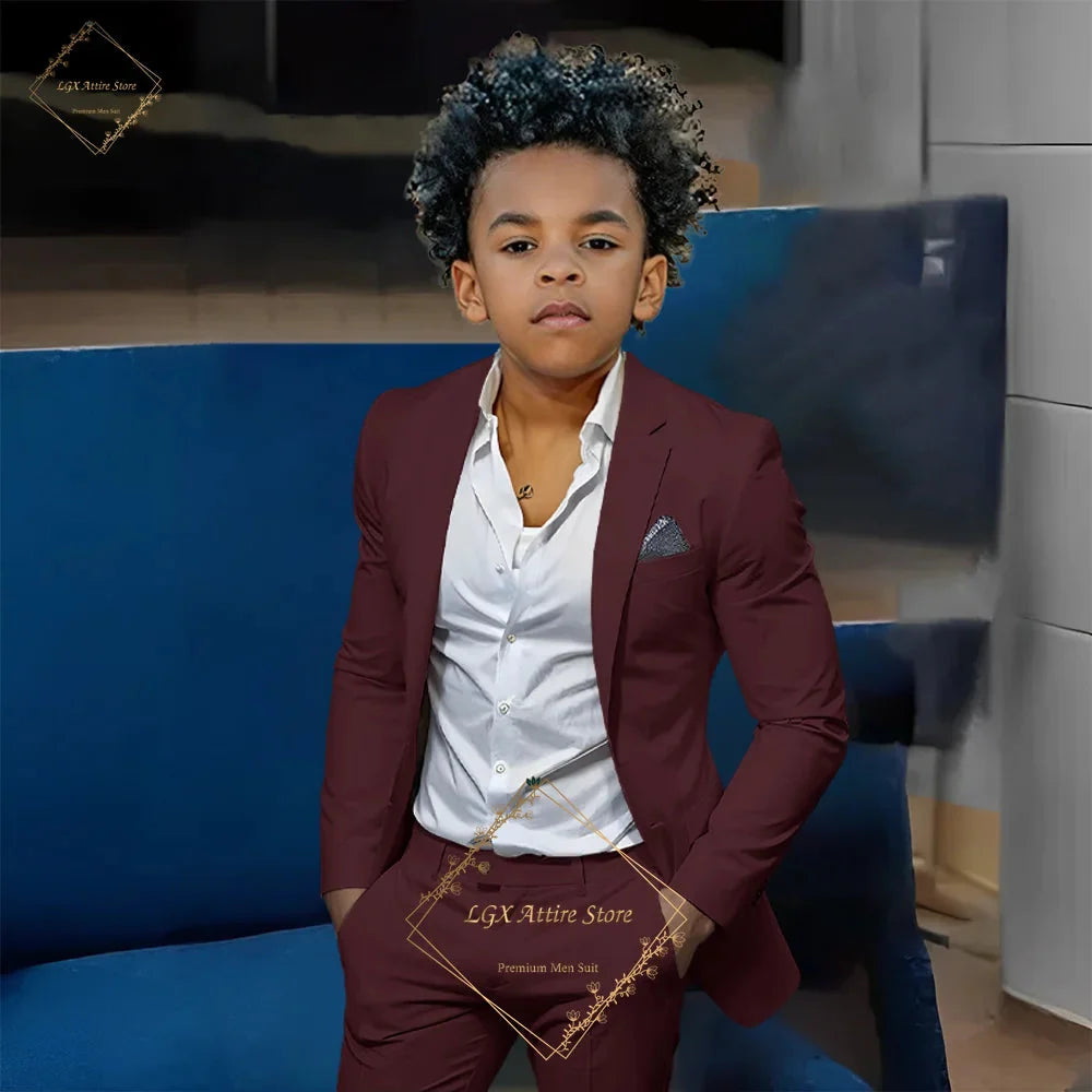 Orange boys' slim fit 2-piece suit by SHOWLU FASHION STORE, featuring a single-breasted twill jacket and matching trousers.