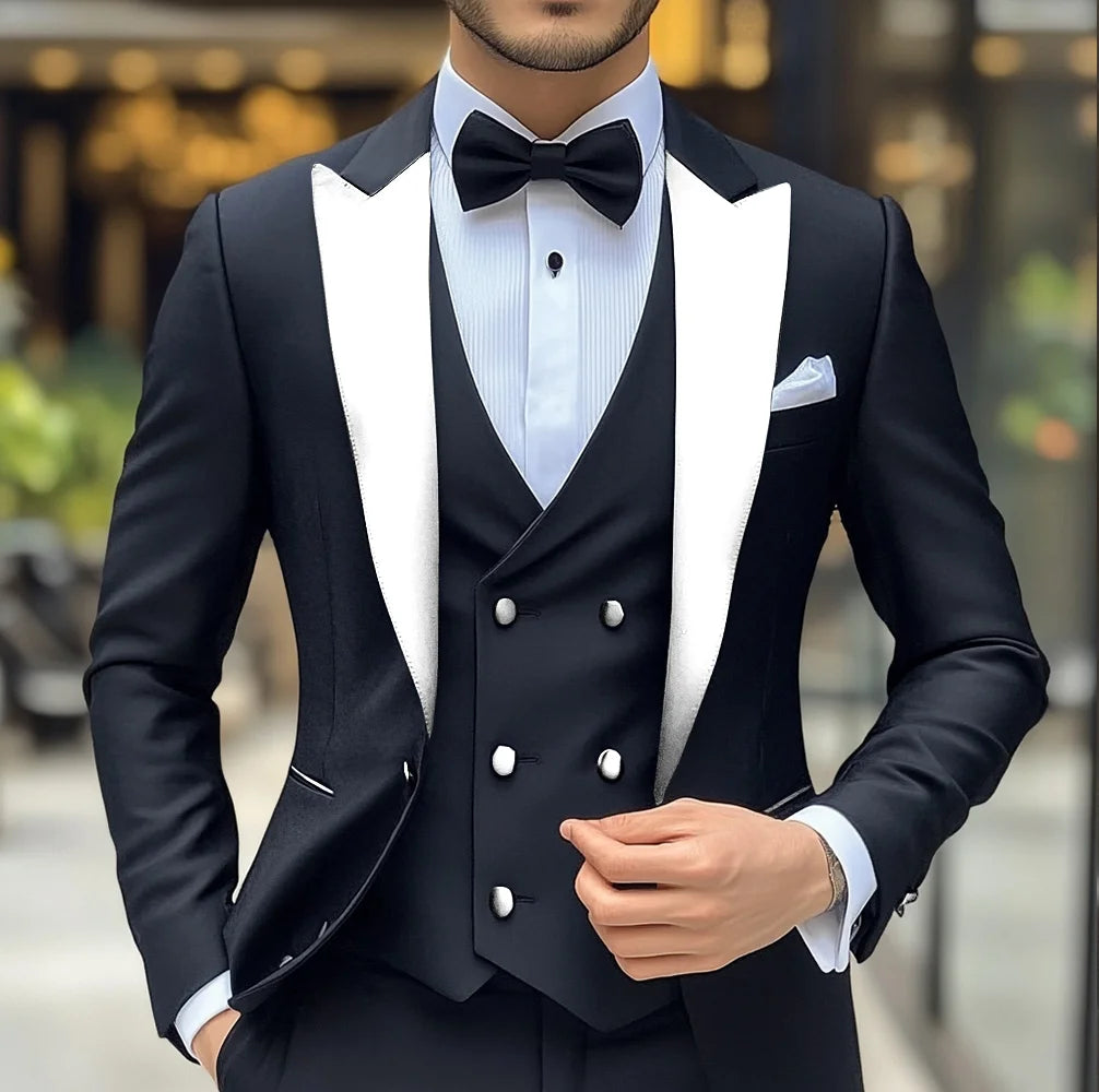 Men's black groom wedding tuxedo suit with slim fit jacket, pants, and vest featuring peak lapel, formal attire by Showlu Fashion