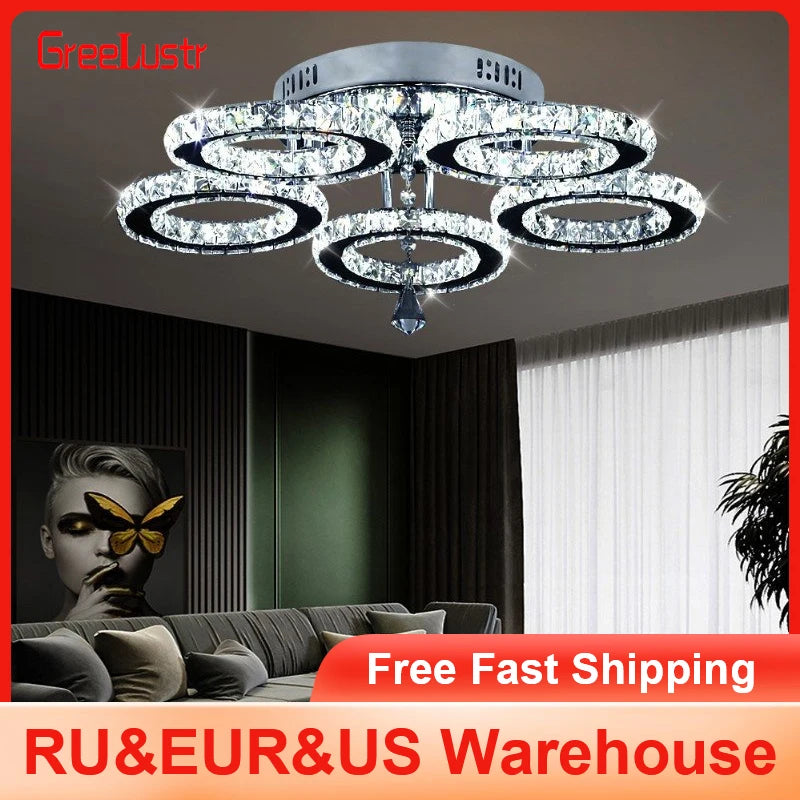 Modern crystal chandelier with chrome finish and LED ceiling light, featuring multiple hanging crystal accents and a sleek flush mount design.