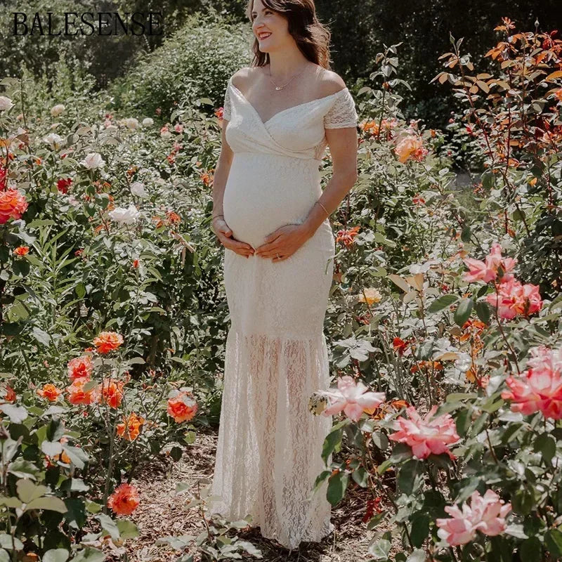 Showlu V-neck lace maternity dress with short sleeves and a flowing maxi gown design, ideal for maternity photography.