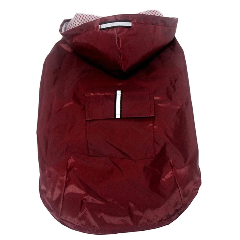 A solid maroon dog raincoat with a hood, a back pocket, and a reflective stripe.