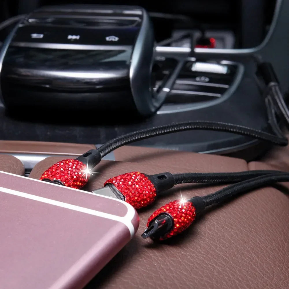 Pink crystal Showlu dual USB car charger with 3-in-1 charging cable, compact design for convenient in-car device charging.