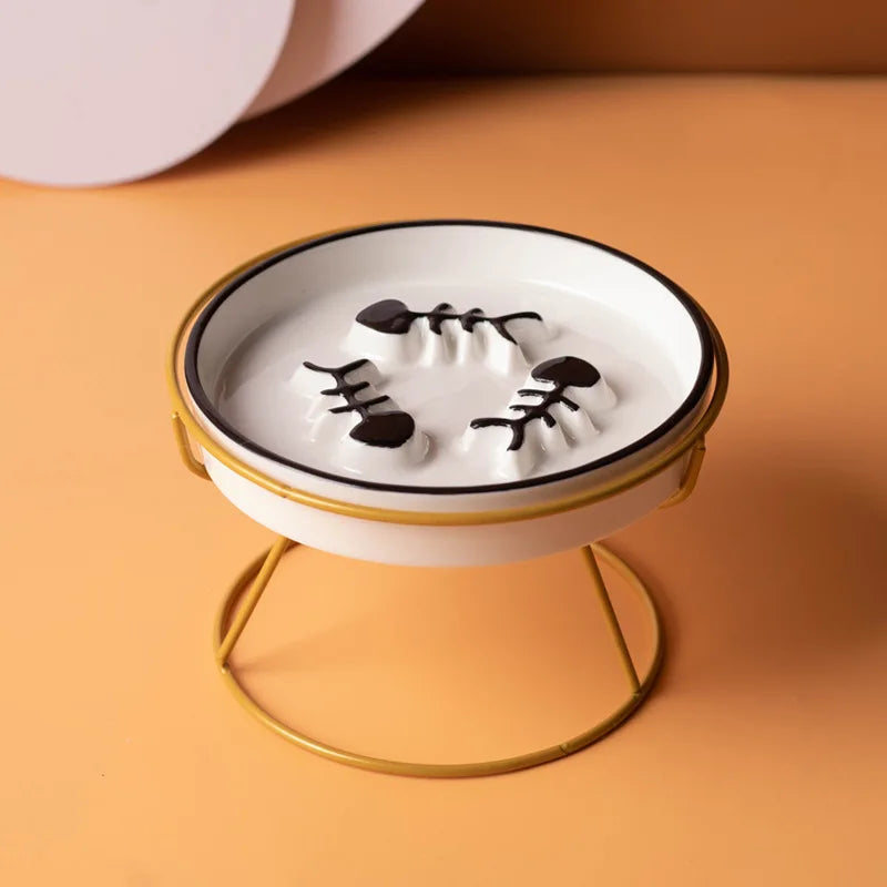 Ceramic cat bowl with high foot design, slow food grain plate, anti-choking feature, black chin protection, and stylish Showlu branding.