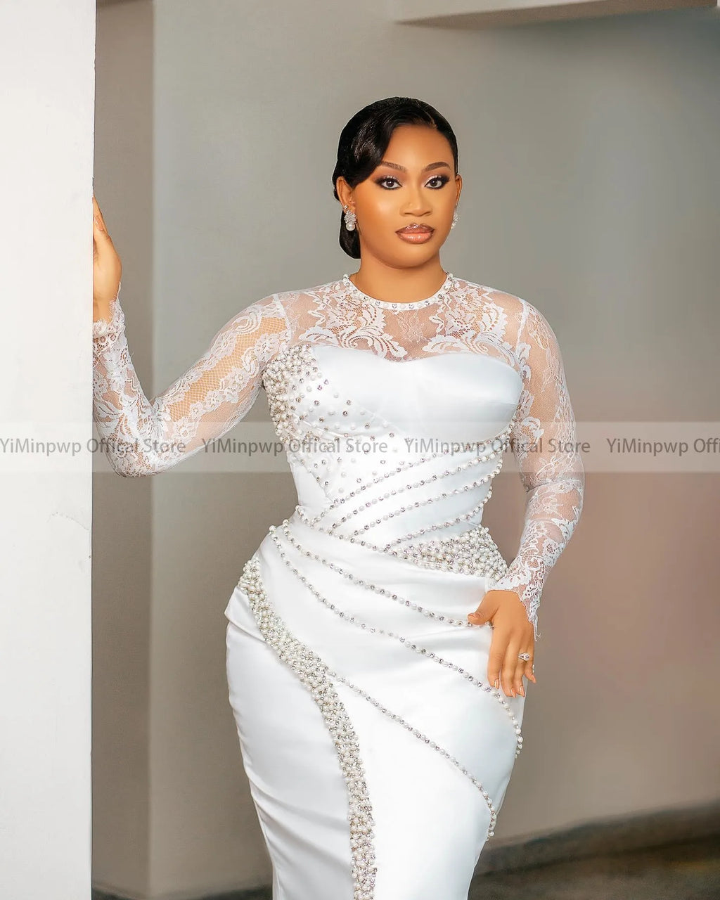 Elegant YiMinpwp lace wedding dress with long sleeves and pearl embellishments, featuring a tea-length bridal gown design.