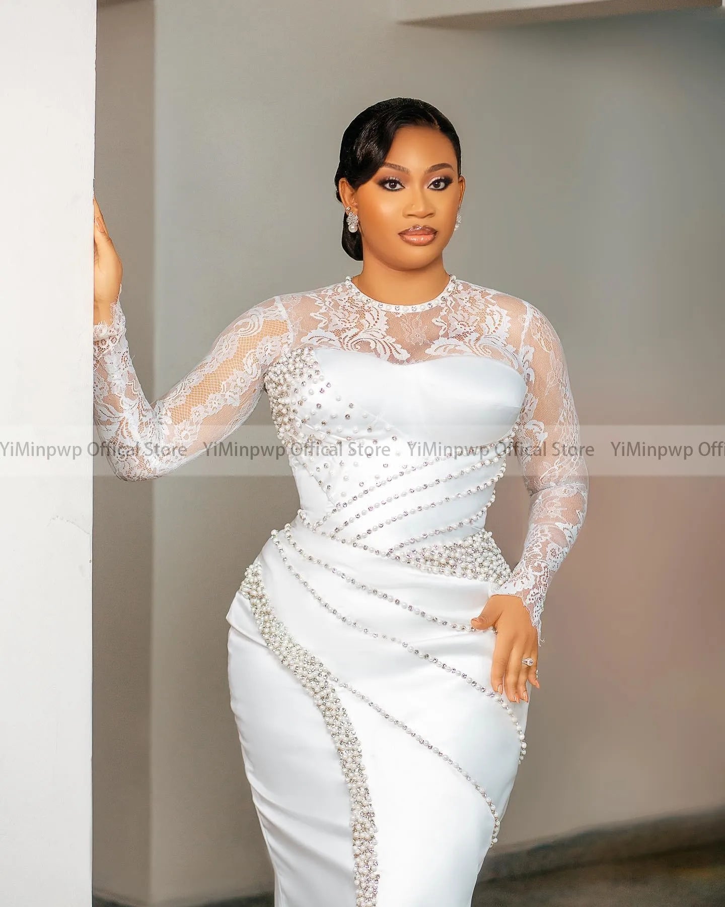 Elegant YiMinpwp lace wedding dress with long sleeves and pearl embellishments, featuring a tea-length bridal gown design.