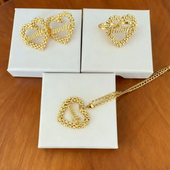 A gold-toned jewelry set featuring heart-shaped nameplates with the name Jennifer.