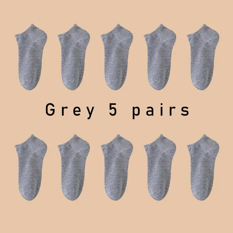 Five pairs of Showlu Fashion low cut boat socks for women and men, breathable, anti-slip, no-show ankle socks in solid colors.