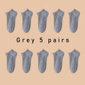 Five pairs of Showlu Fashion low cut boat socks for women and men, breathable, anti-slip, no-show ankle socks in solid colors.