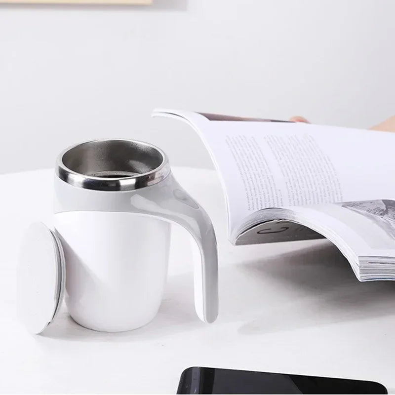 Rechargeable electric magnetic coffee stirring cup by Showlu Fashion, with sleek black design and stainless steel interior.