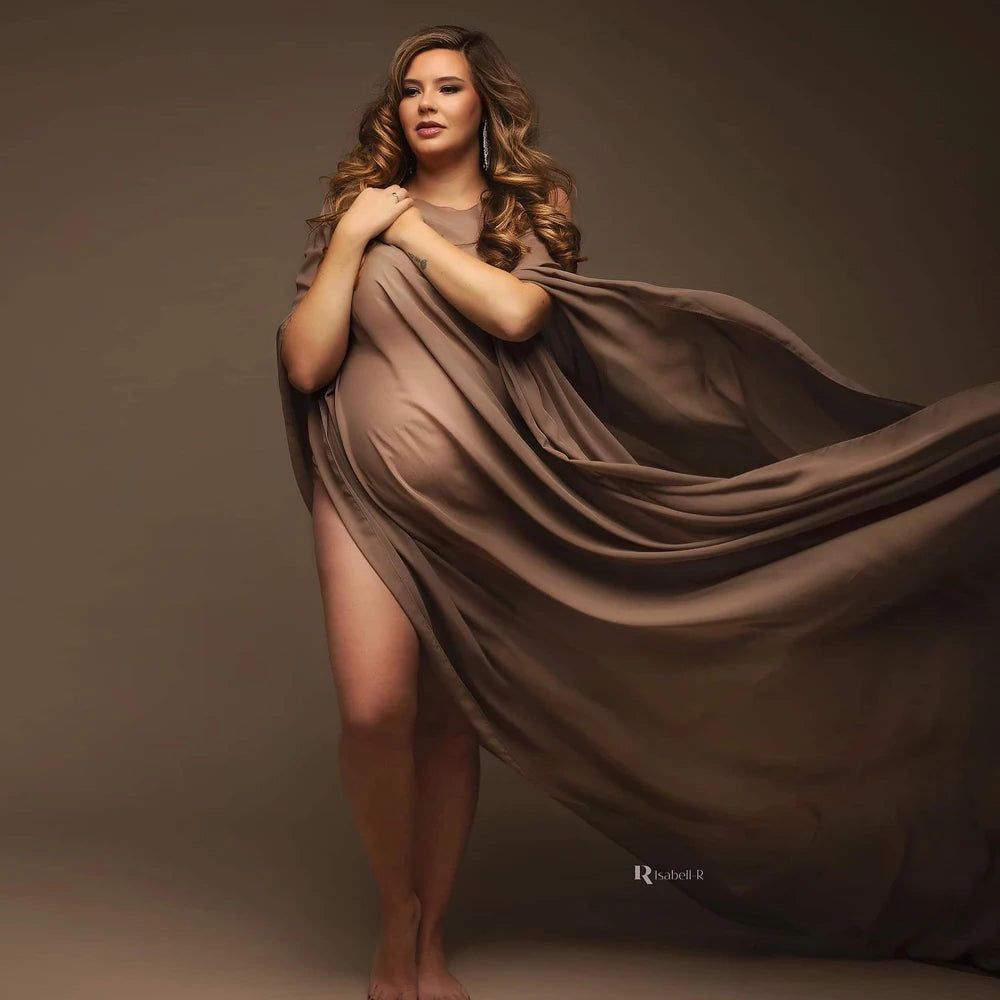 Showlu Maternity chiffon cape made of soft tulle, perfect for photo shoots, draped over a pregnant woman for a graceful look.