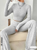 Stand collar Navel T-shirt and trumpet pants from Showlu Fashion Store, featuring stylish design and comfortable fit.