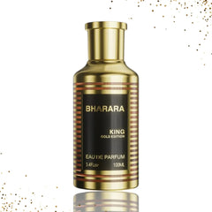 A gold-toned cylindrical perfume bottle with a black label reading Bharara King Gold Edition.