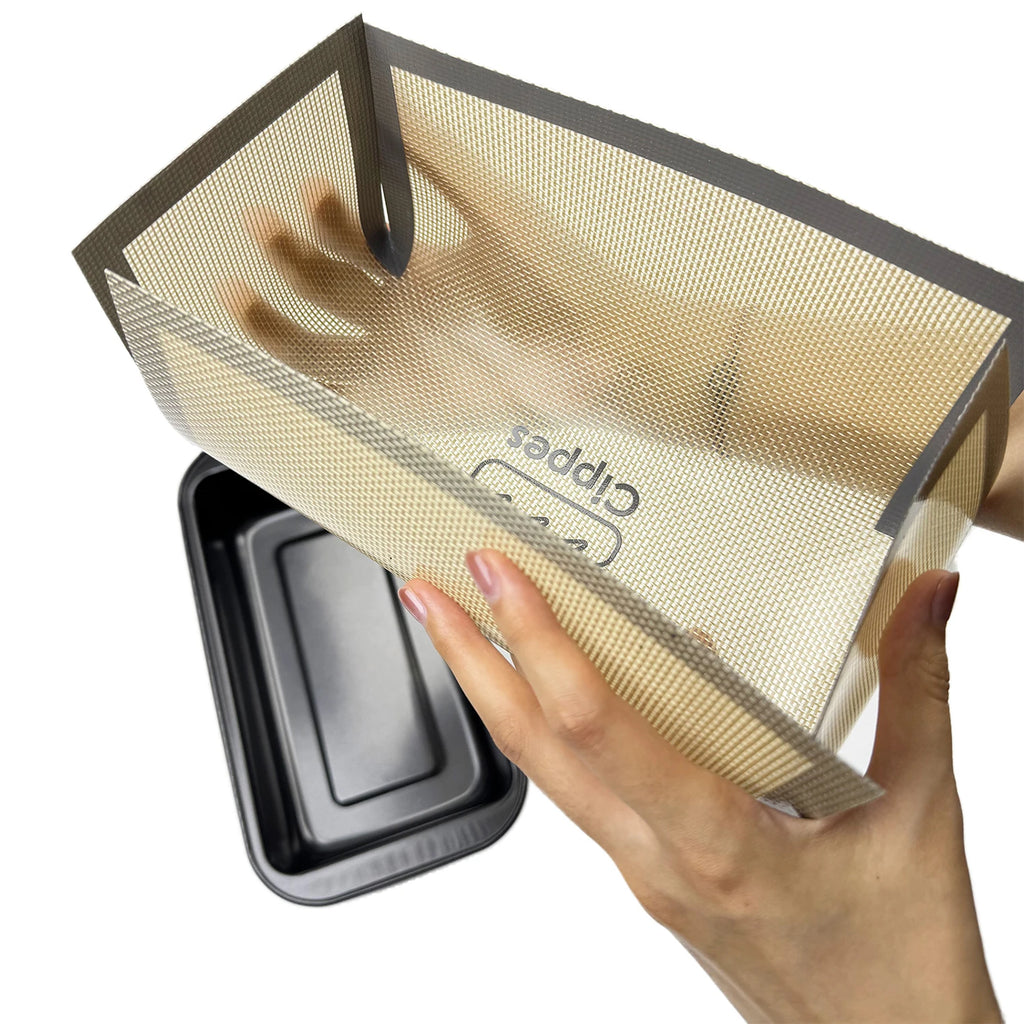 Showlu Smart General silicone baking mat laid flat, showing textured non-stick surface for baking and pastry preparation.