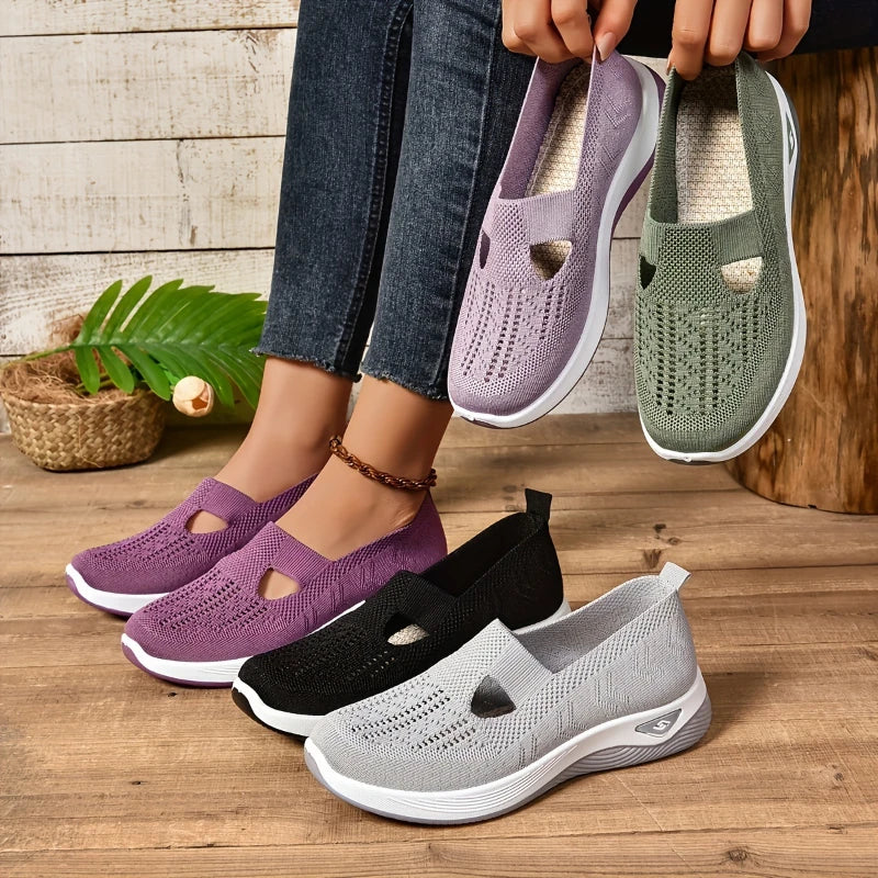 Lightweight women's slip-on sneakers by Showlu Fashion with breathable mesh upper, soft sole, and low-top design for casual walking.