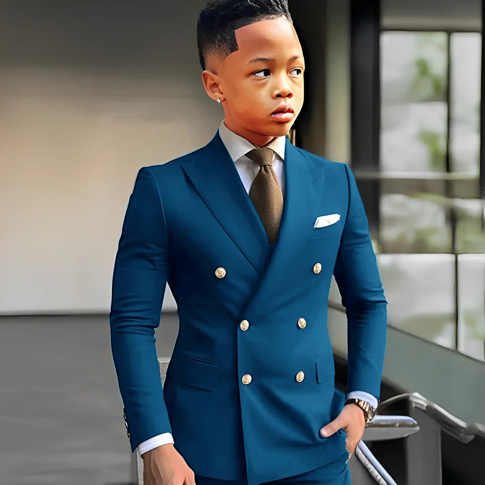 Navy blue solid boy's tuxedo with peak lapel, double-breasted, two-piece suit for formal occasions and weddings.