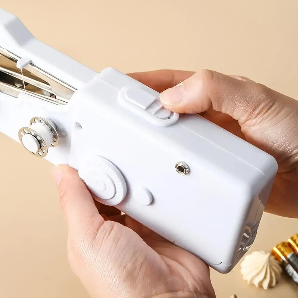 Showlu Smart General mini handheld sewing machine with compact design and built-in thread spool, ideal for quick sewing repairs.