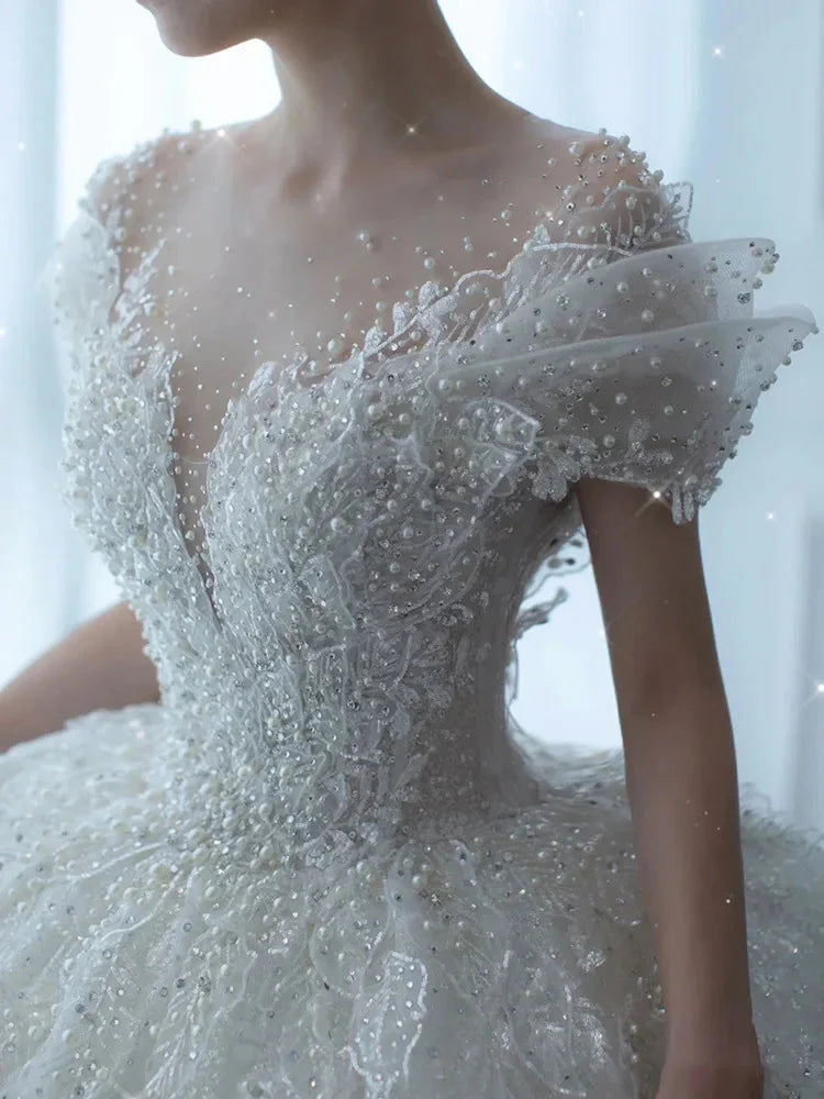 SHOWLU FASHION Crystal Beaded Tulle Ball Gown Wedding Dress with intricate beading and flowing tulle skirt, elegant bridal attire.