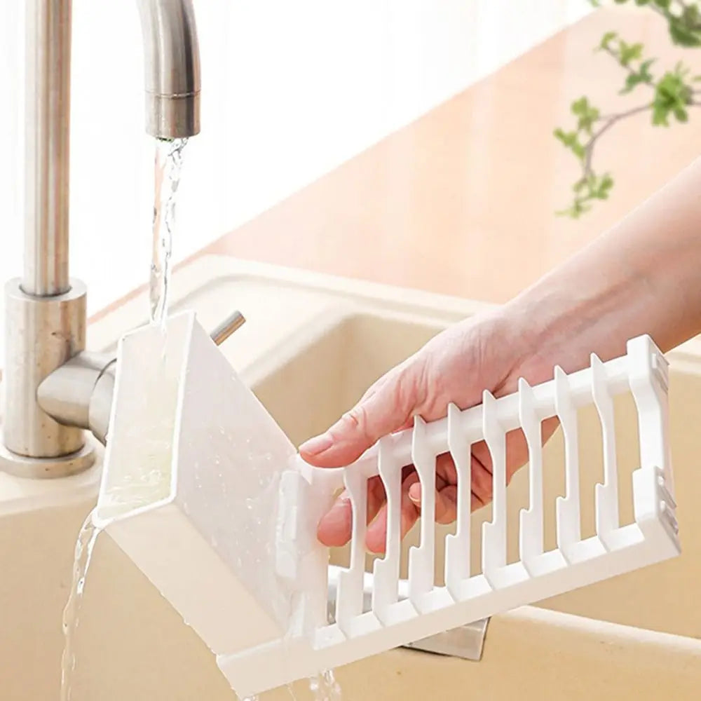 Showlu Smart General foldable dish drying rack with metal frame and multiple slots for drying dishes and utensils.