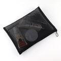 Large black portable outdoor makeup bag with transparent mesh compartments, ideal for travel and home organization.
