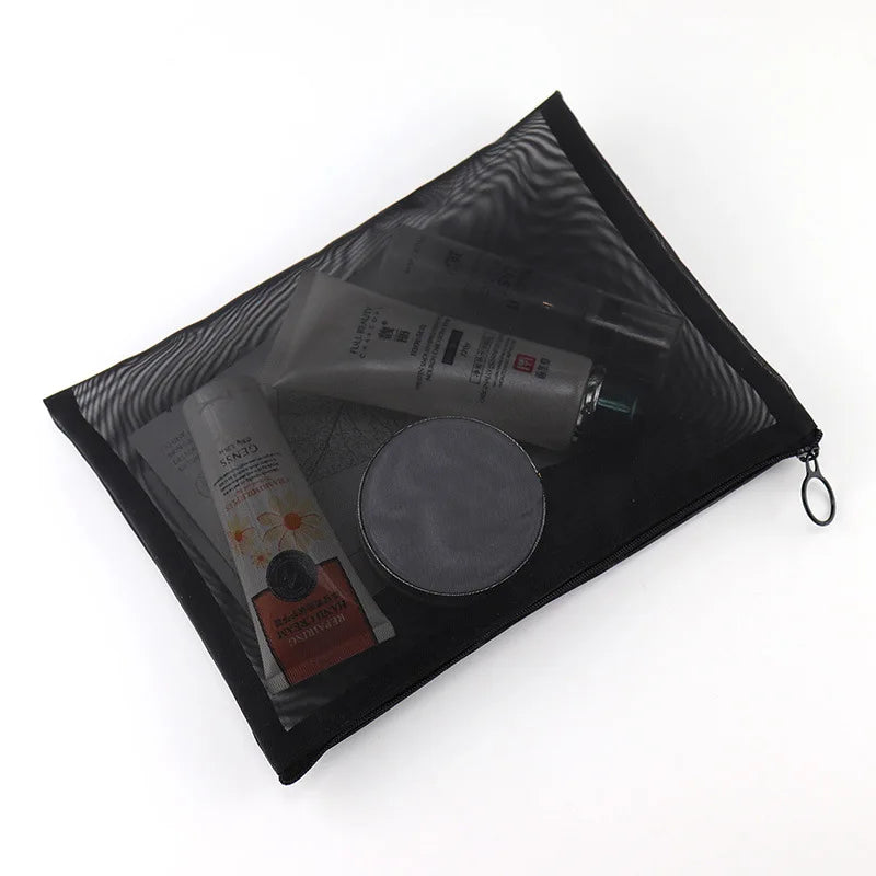Large black portable outdoor makeup bag with transparent mesh compartments, ideal for travel and home organization.