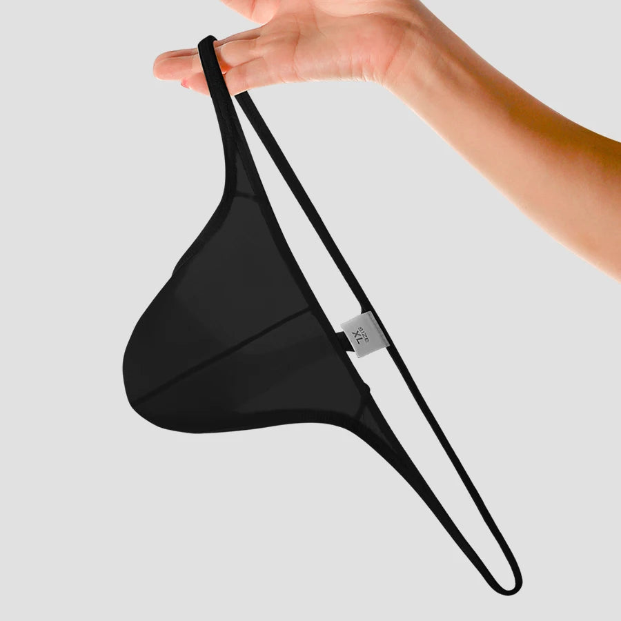 Showlu men's low-rise solid thong underwear in breathable nylon with stretchy fit, showcasing smooth fabric and comfortable design.