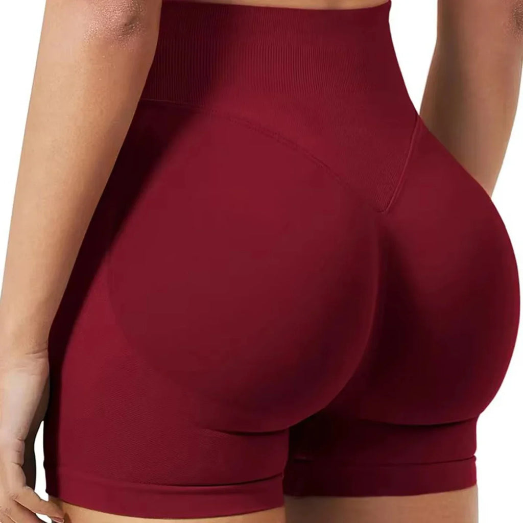 Women's seamless ribbed yoga shorts by SHOWLU FASHION STORE, high stretch gym booty shorts for comfortable workout wear.