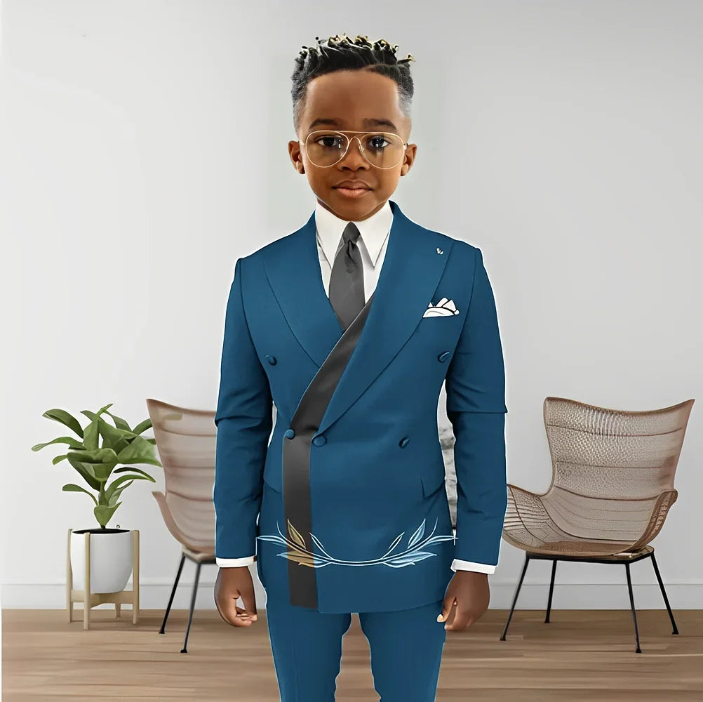 Boy wearing a double-breasted blazer and pants from Showlu Fashion's boys’ wedding tuxedo 2-piece set, age 2-16.