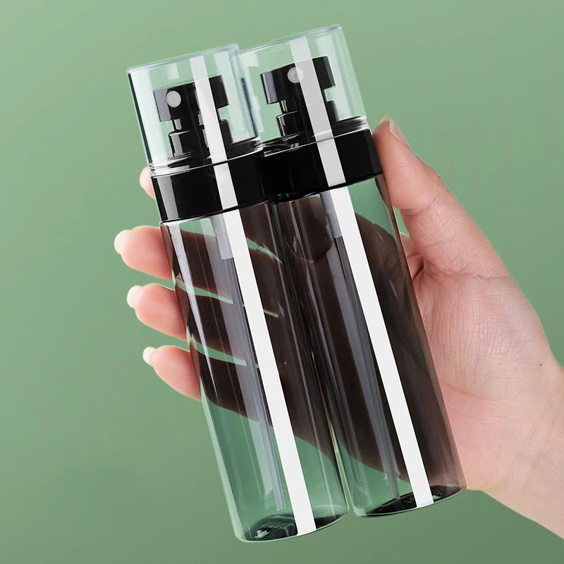 Showlu Smart General oil control spray bottle with a sleek, transparent design and adjustable nozzle for even application.