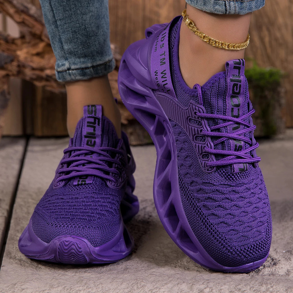 Purple women's sneakers with cushioned EVA soles, lightweight anti-slip design, ideal for running and casual wear.