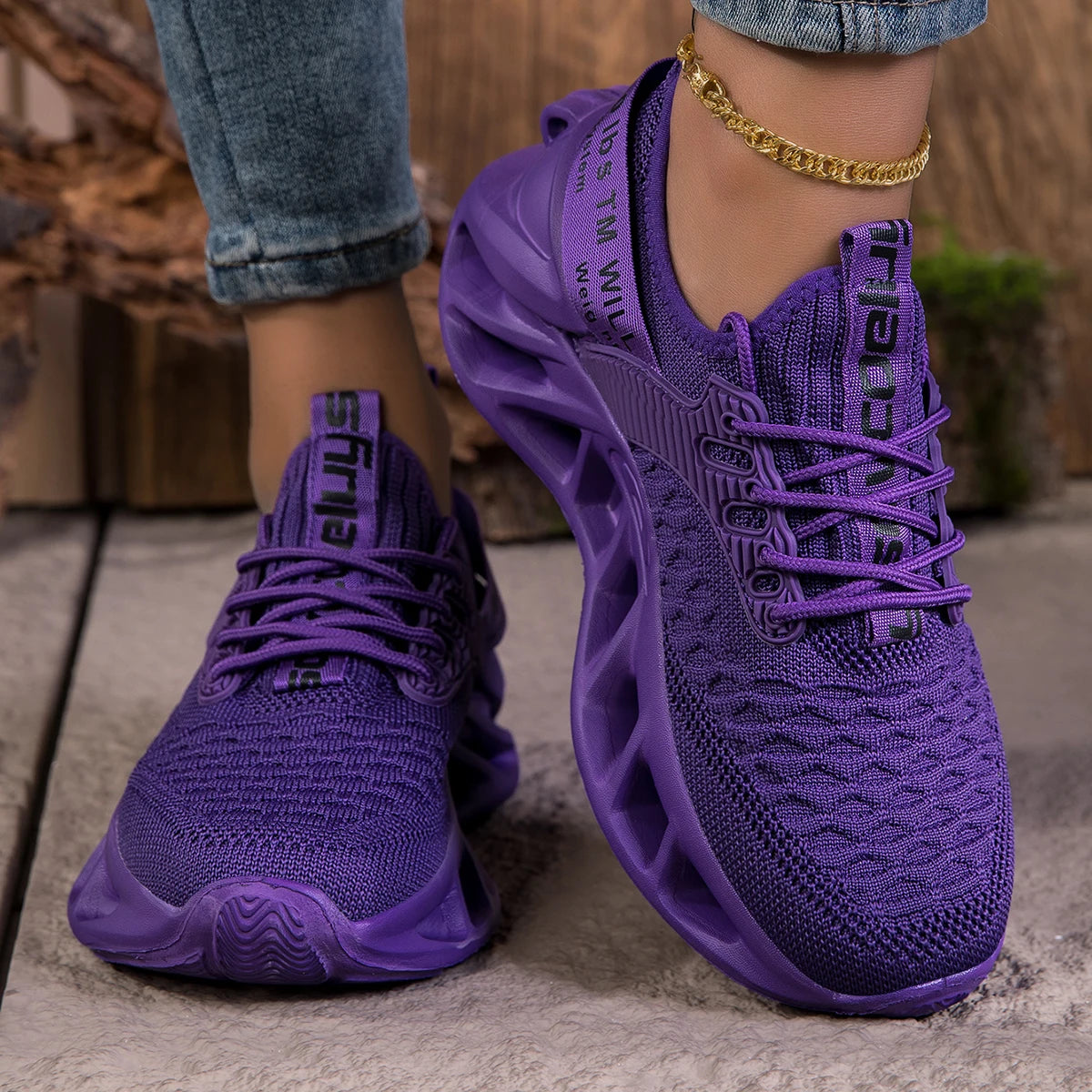 Purple women's sneakers with cushioned EVA soles, lightweight anti-slip design, ideal for running and casual wear.