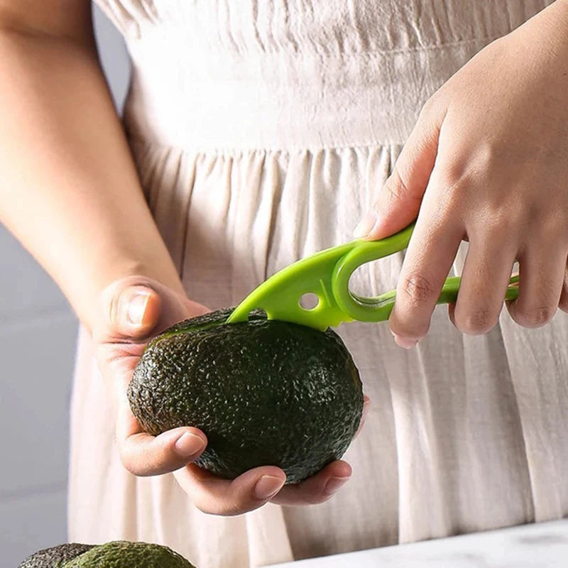 Showlu Smart General 3-in-1 avocado tool with peeler, pitter, and slicer for efficient fruit preparation.