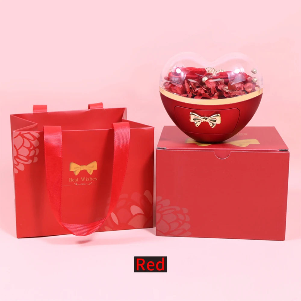 Heart-shaped Showlu Fashion jewelry box with a stylish necklace gift set, featuring elegant jewelry inside and decorative packaging.