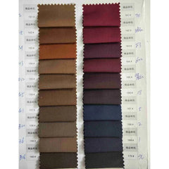 A fabric swatch card displaying two columns of various brown and red textile samples.