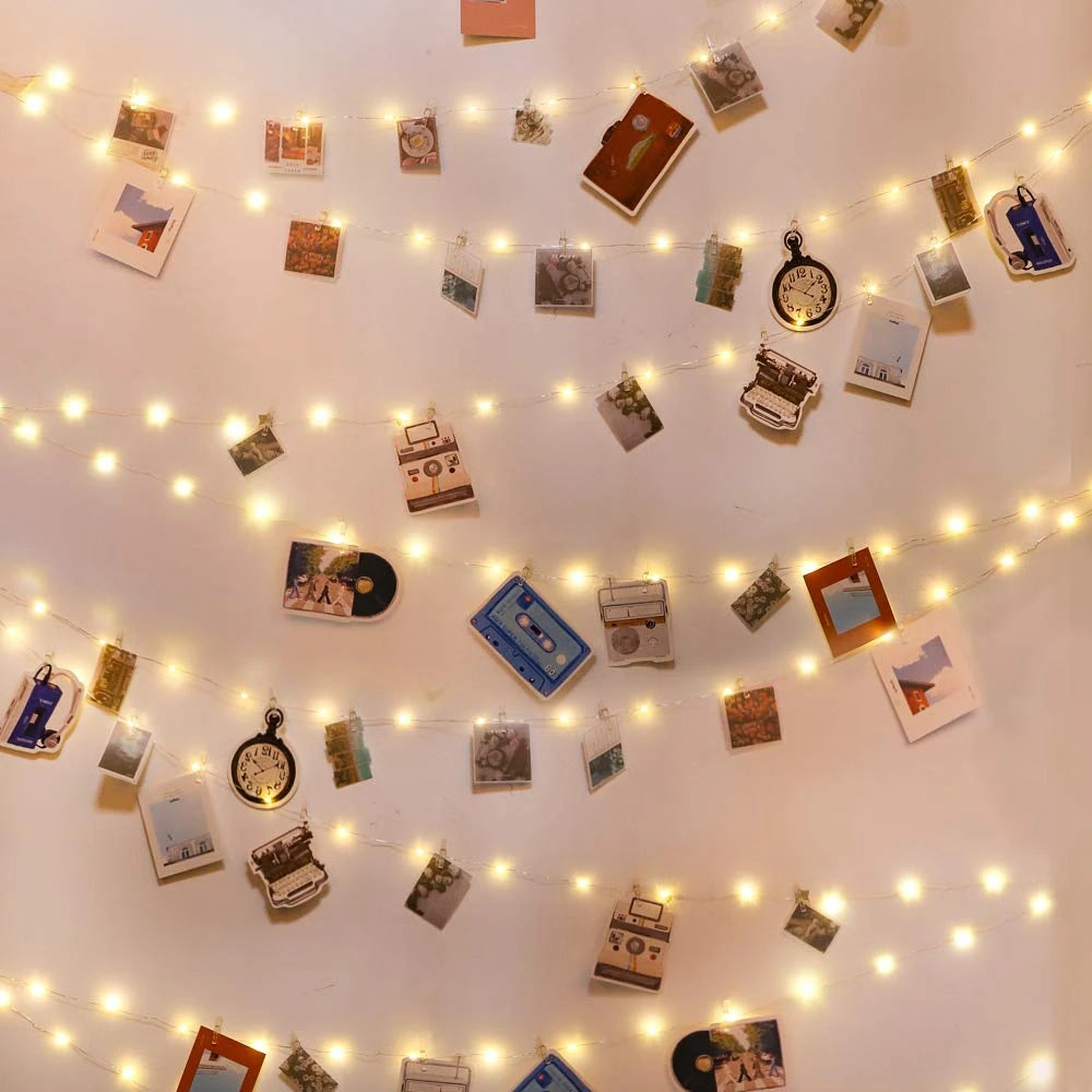 Showlu Smart General LED photo clip string lights hanging with clips and warm white bulbs for decorative lighting.