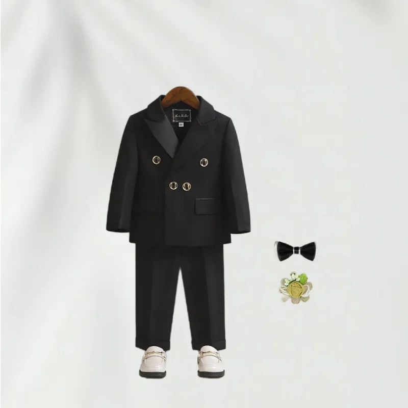 Children's white wedding suit with jacket, pants, and bowtie, perfect for flower boys and birthday parties.