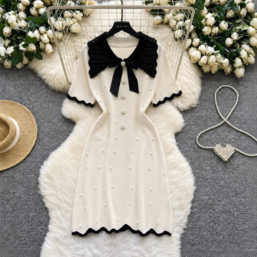 Elegant 2026 summer women's pearl dress by Showlu Smart General, featuring a bow collar, short sleeves, and bodycon fit.