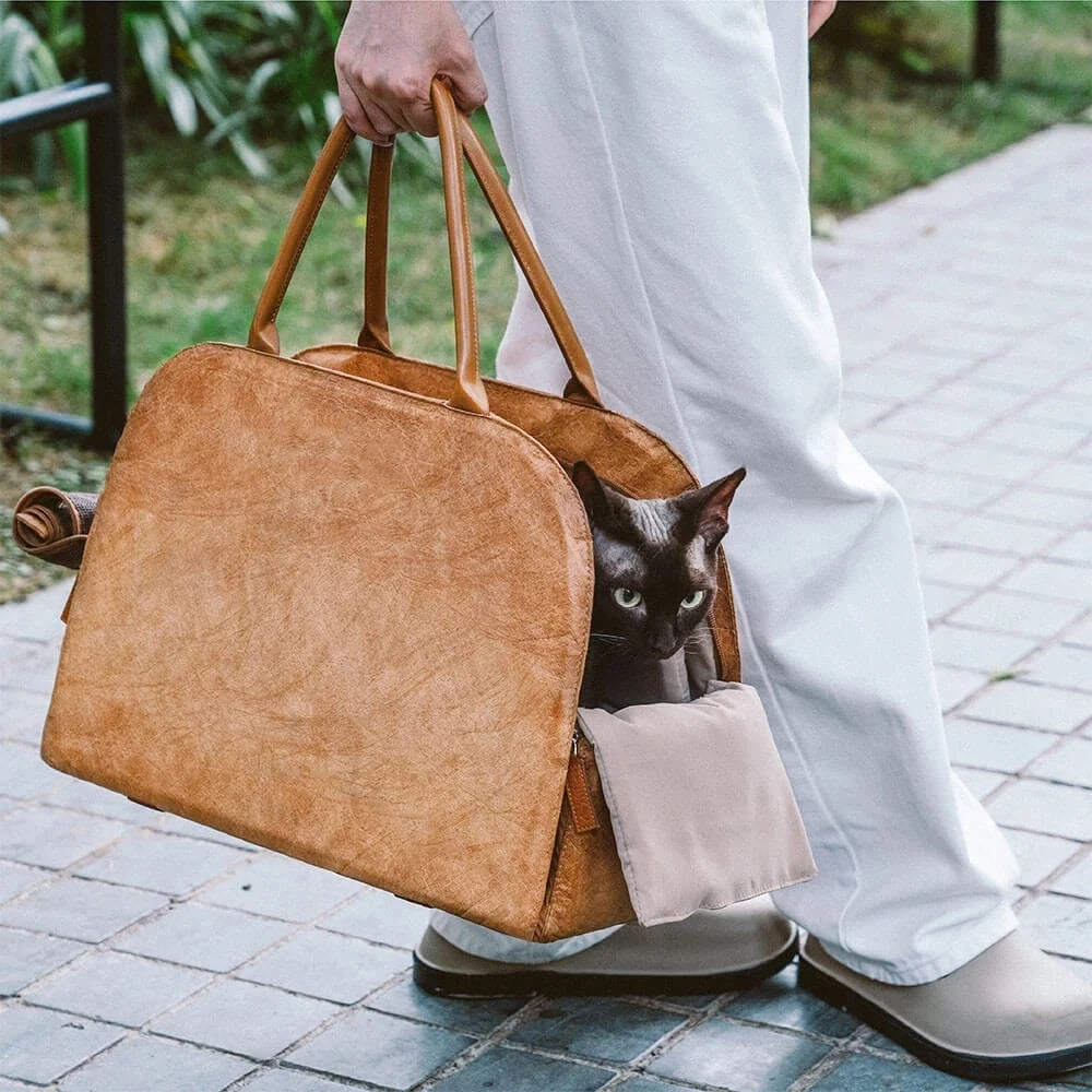 Showlu Fashion YKOSM leather pet carrier bag with windproof design, warm travel bag featuring soft mat for pets.