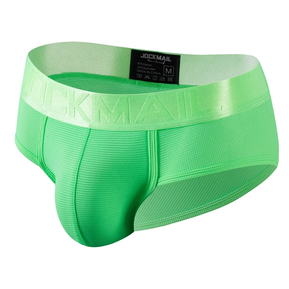 Men's nylon mesh briefs by Showlu Fashion with quick-dry solid color design, showcasing lightweight, breathable underwear.