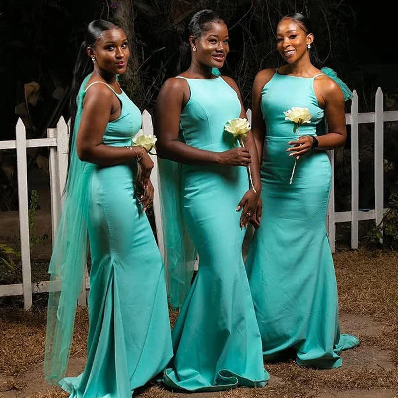 Turquoise JC&STAR mermaid satin bridesmaid dress with sexy backless design, elegant gown featuring fitted silhouette and flowing fabric